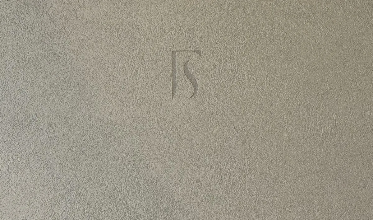 Forma monogram worked into a floated microcement finish
