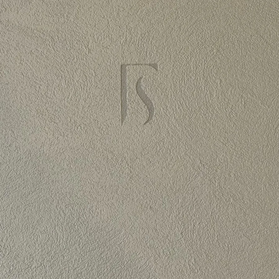Bespoke Forma monogram worked into a commercial microcement finish