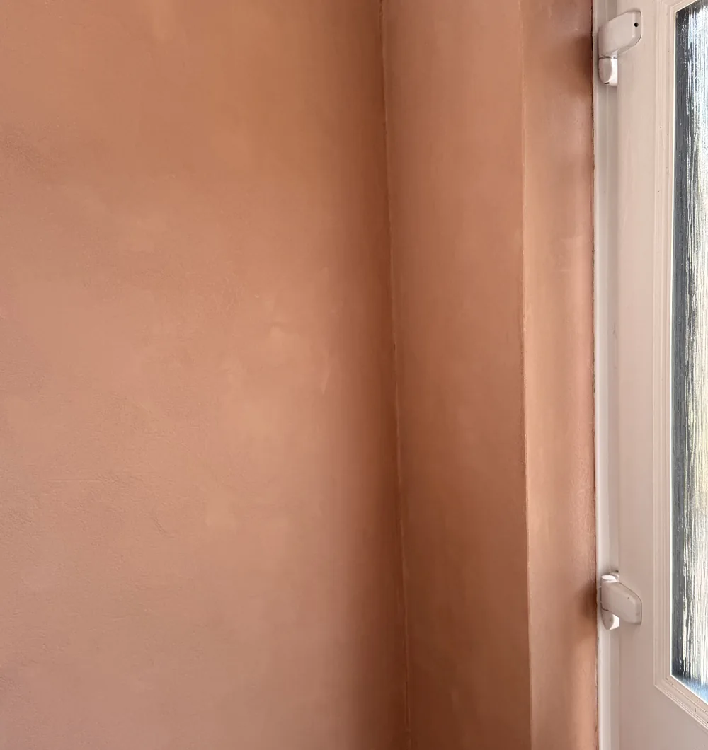 Oltre microcement finish running seamlessly around a corner return