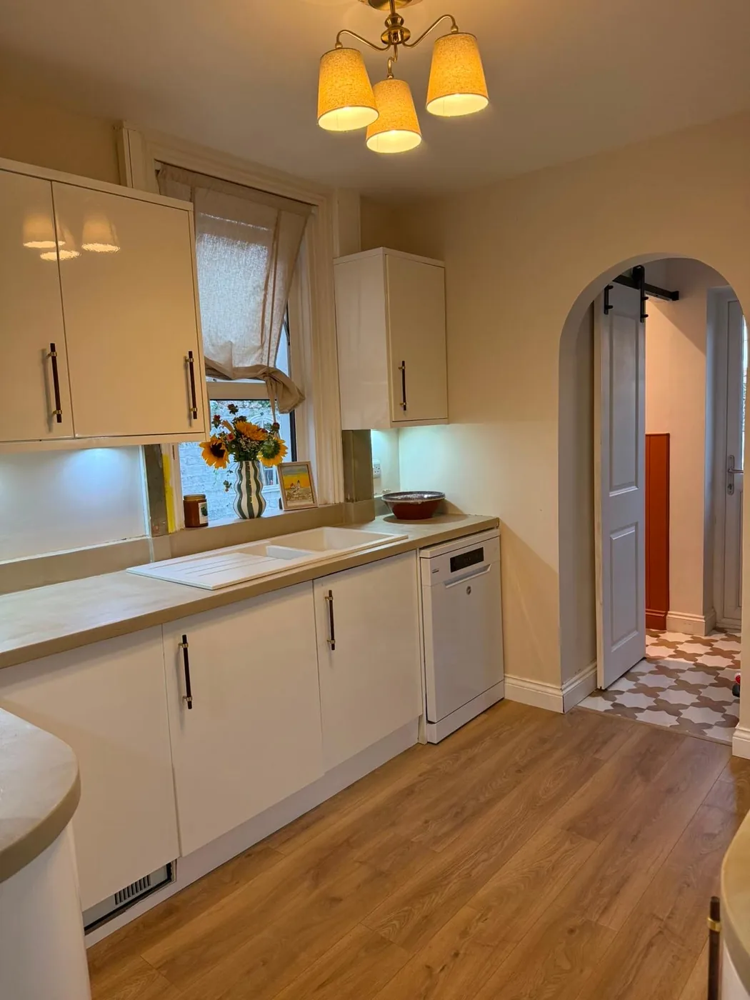 Microcement worktop finished to match the surrounding kitchen, running from hob to sink